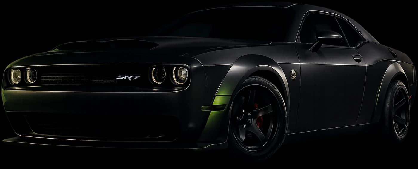 A matte-black muscle car, photographed from the front three-quarter angle